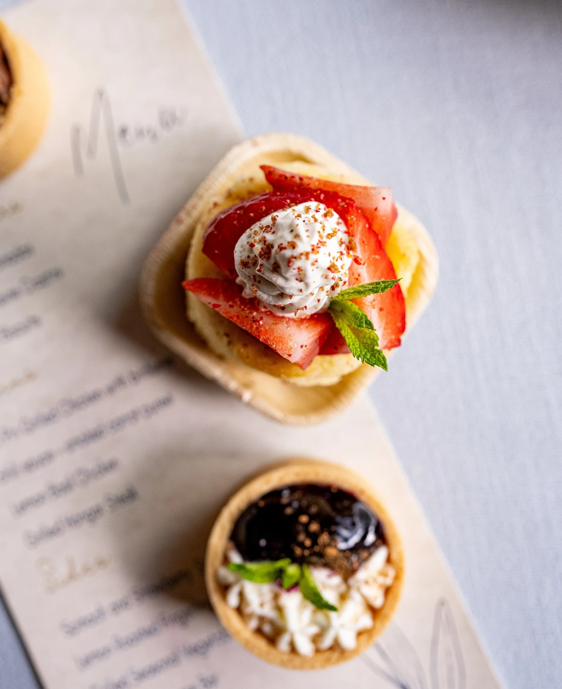 Tartlets beside a printed menu